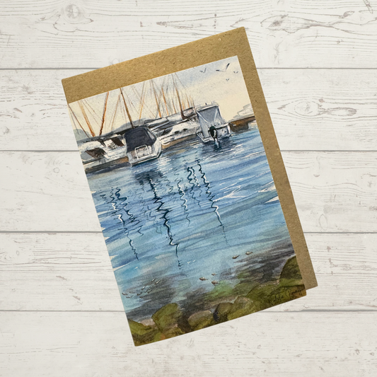 Image of actual card with natural kraft paper envelope. Image depicts boats moored at Mindarie Marina, Perth Western Australia.