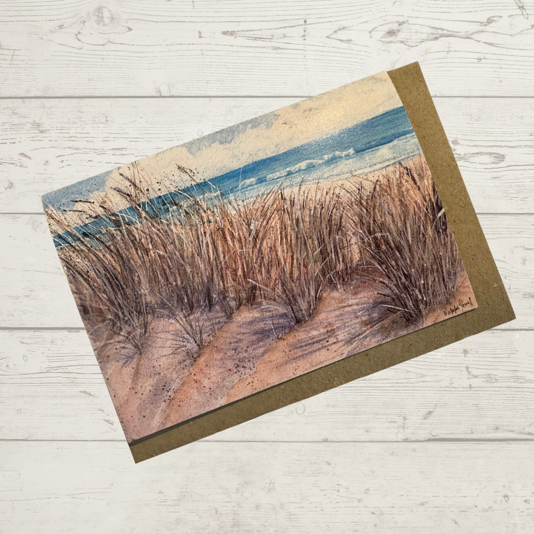 Image of actual card with natural kraft envelope. Image depicts a grassy dune looking through to Clayton's Beach in Perth, Western Australia.