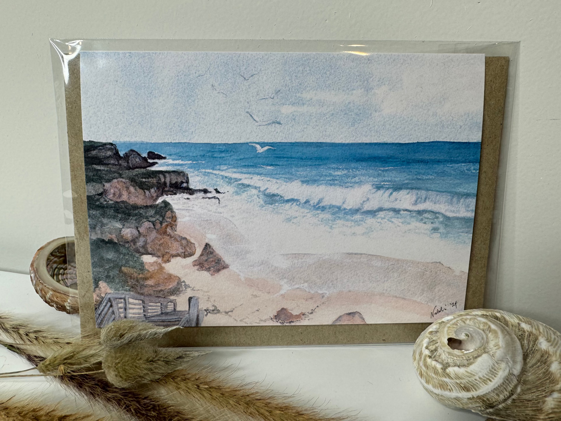 Image of the actual card with cellophane envelope for shipping. Image depicts wooden steps leading down to Burns Beach, Perth, Western Australia.